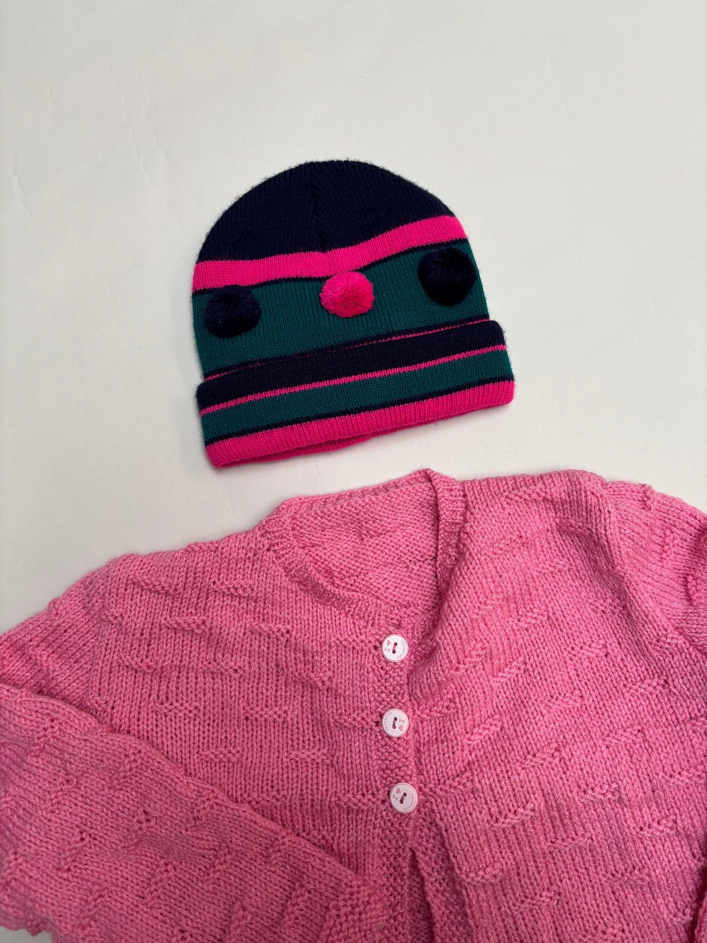 muts met pompons (4/6 jaar)